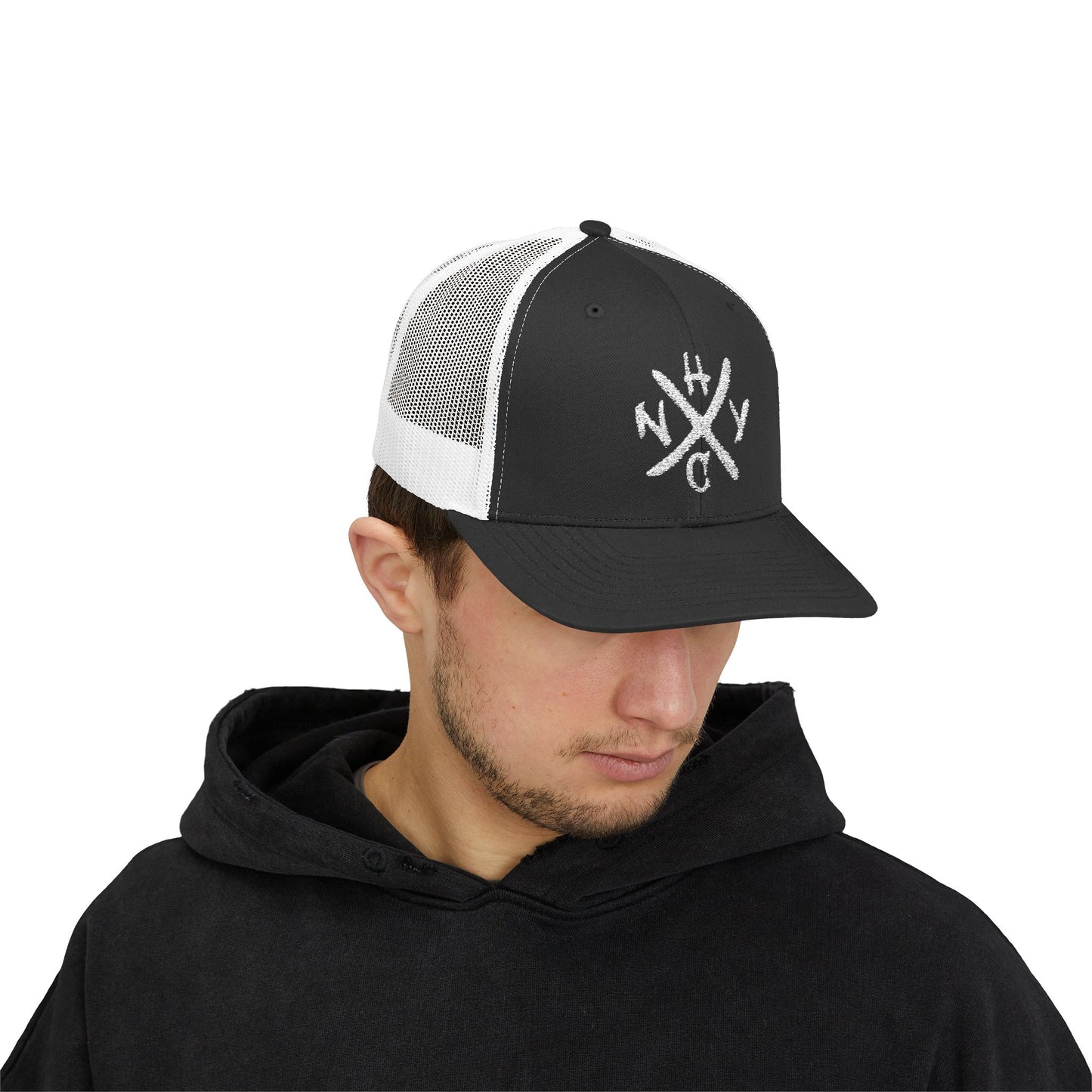 Man wearing a black and white cap with a NYHC logo on a white background