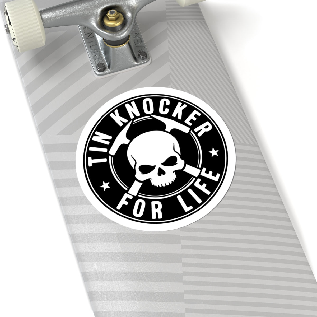 Skateboard with a 'Tin Knocker for Life' sticker on a white background