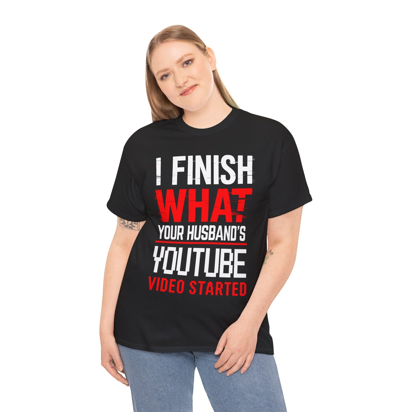 Person wearing a black t-shirt with humorous text design on a white background