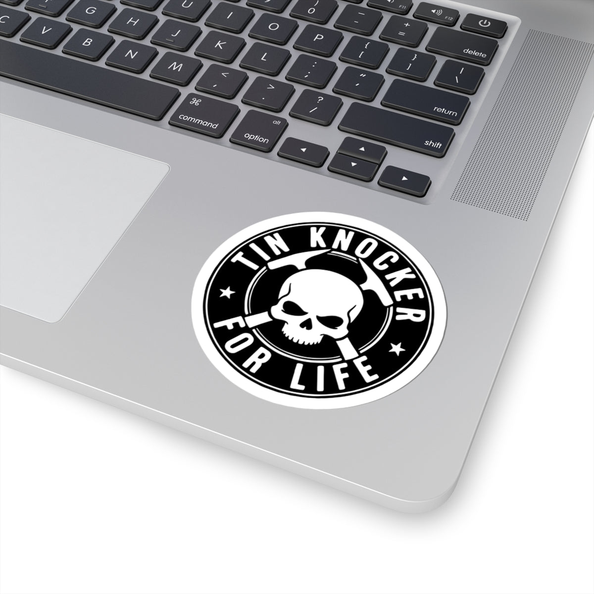 Laptop with a 'Tin Knocker for Life' sticker on the palm rest area