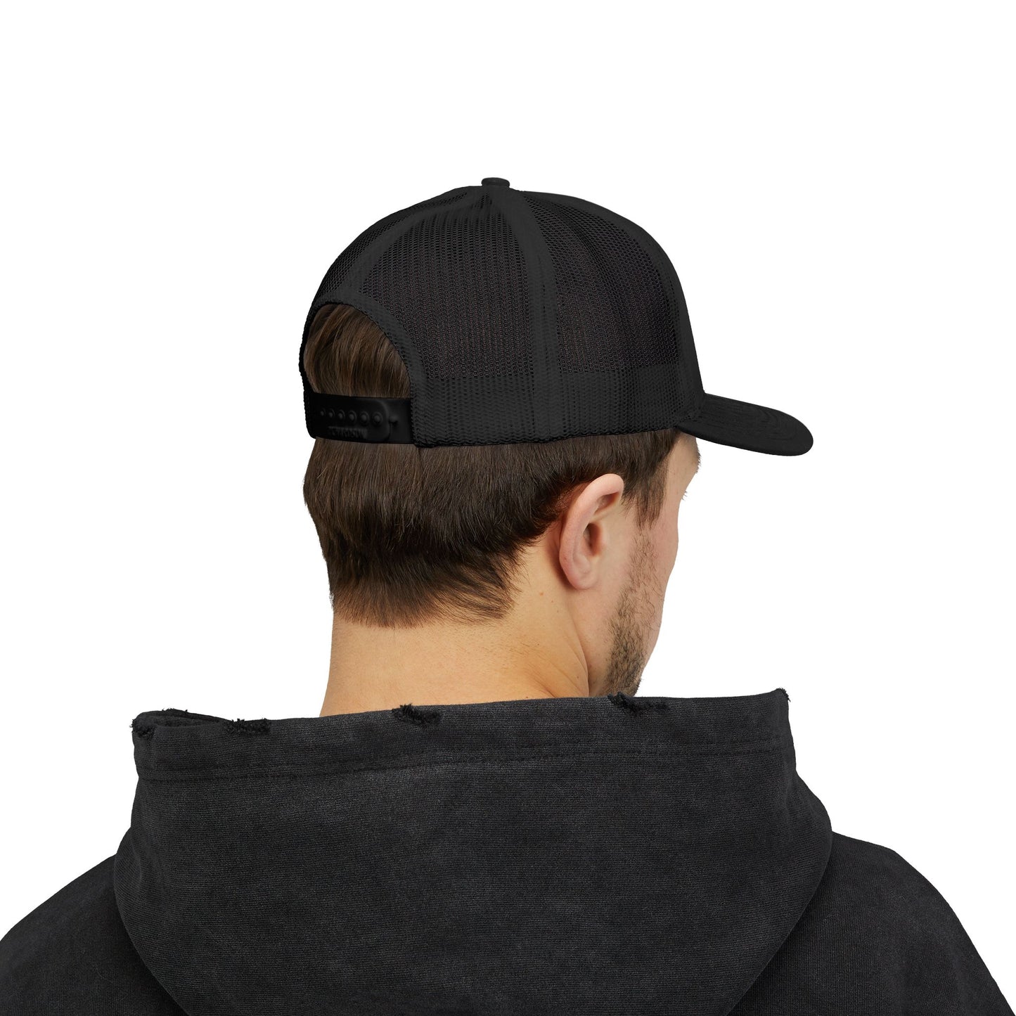 Person wearing a black cap and black hoodie on a white background