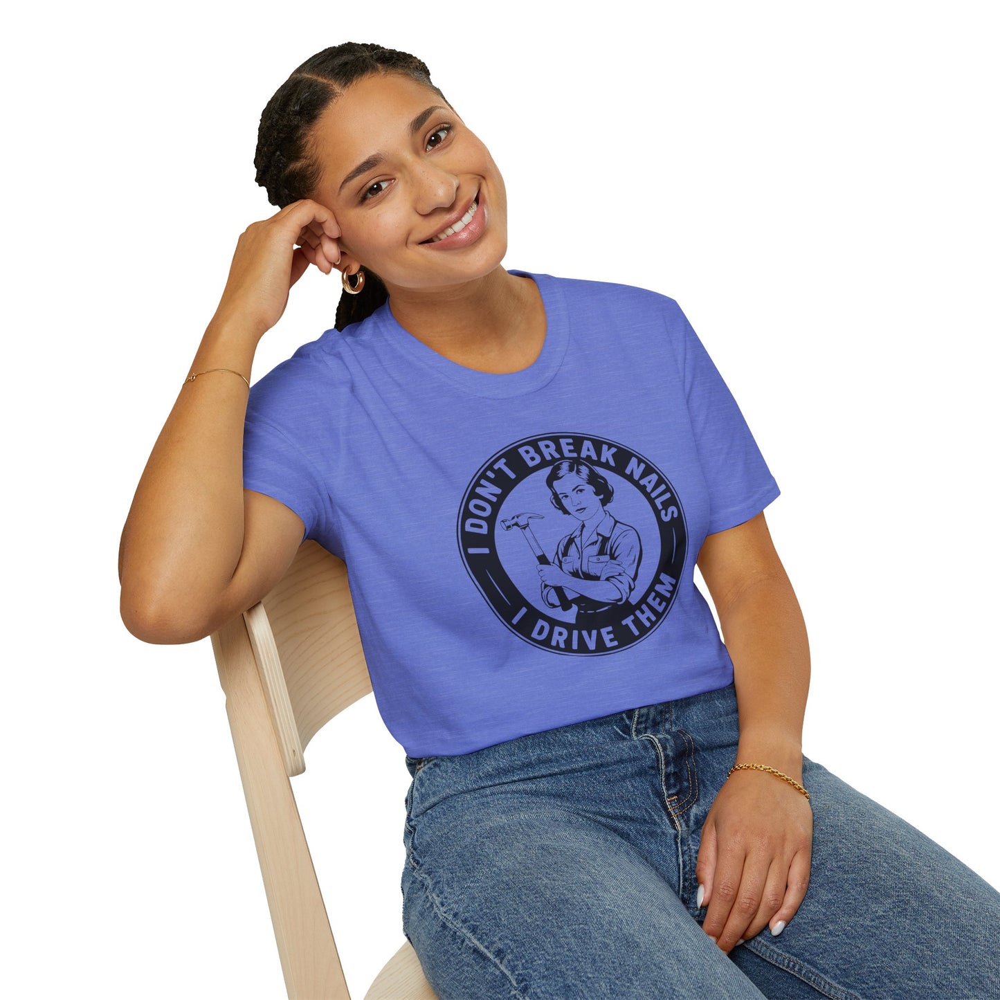 Women wearing a blue t-shirt with a graphic and text 'I don't break nails, I drive them' on a white background