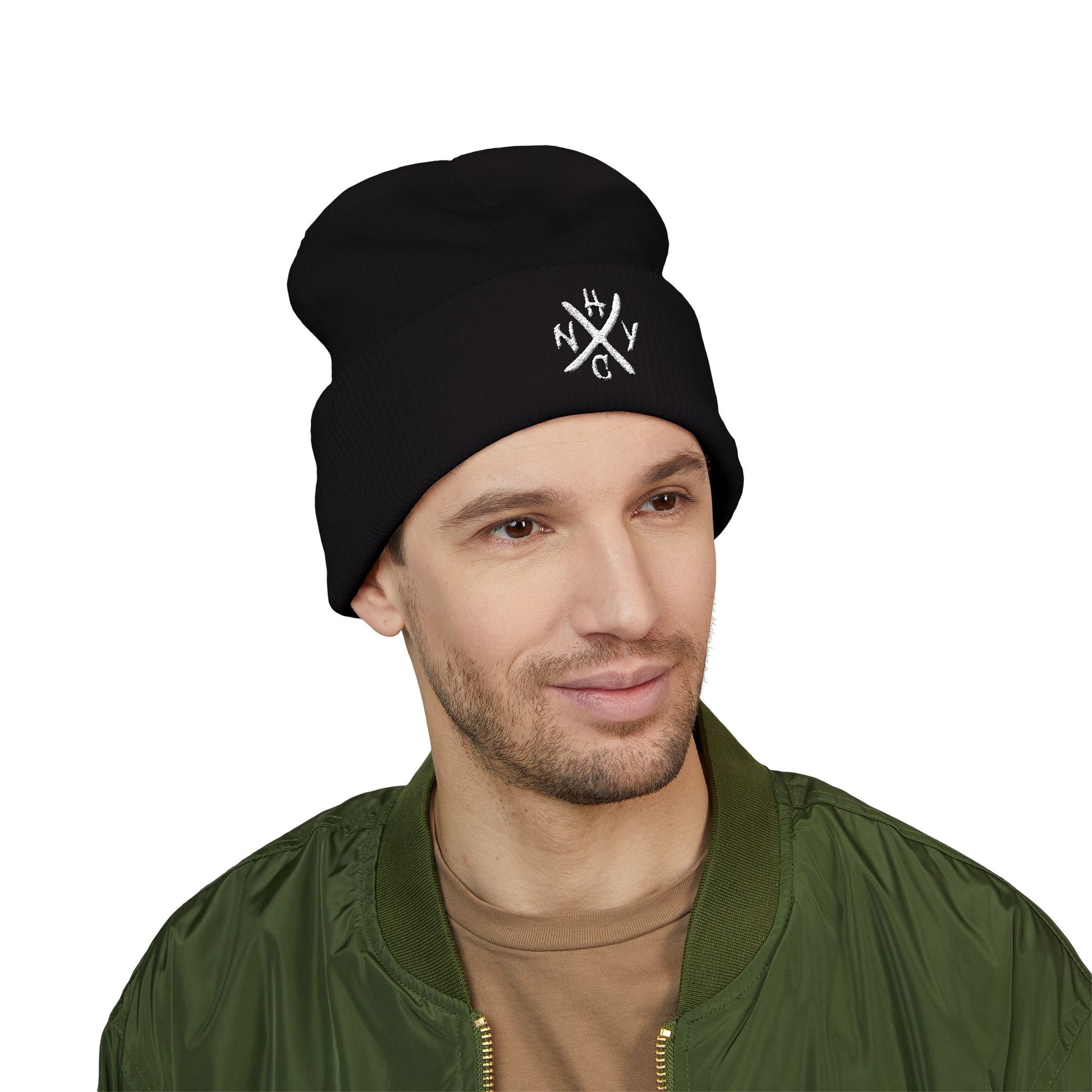 Man wearing a black beanie with a white NYHC logo 