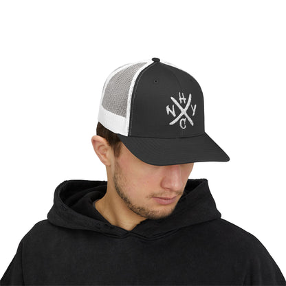 Man wearing a black and white cap with a NYHC logo on a white background