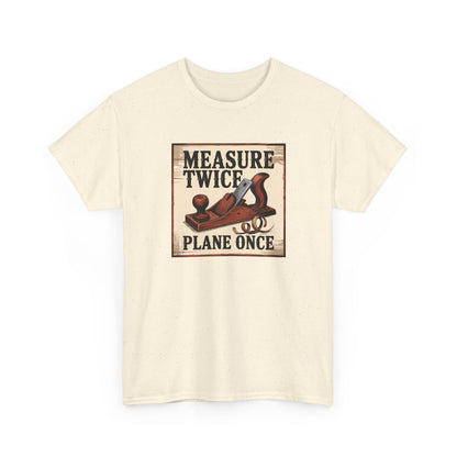 Beige t-shirt with a graphic of a wooden plane and text 'Measure Twice, Plane Once' on a white background