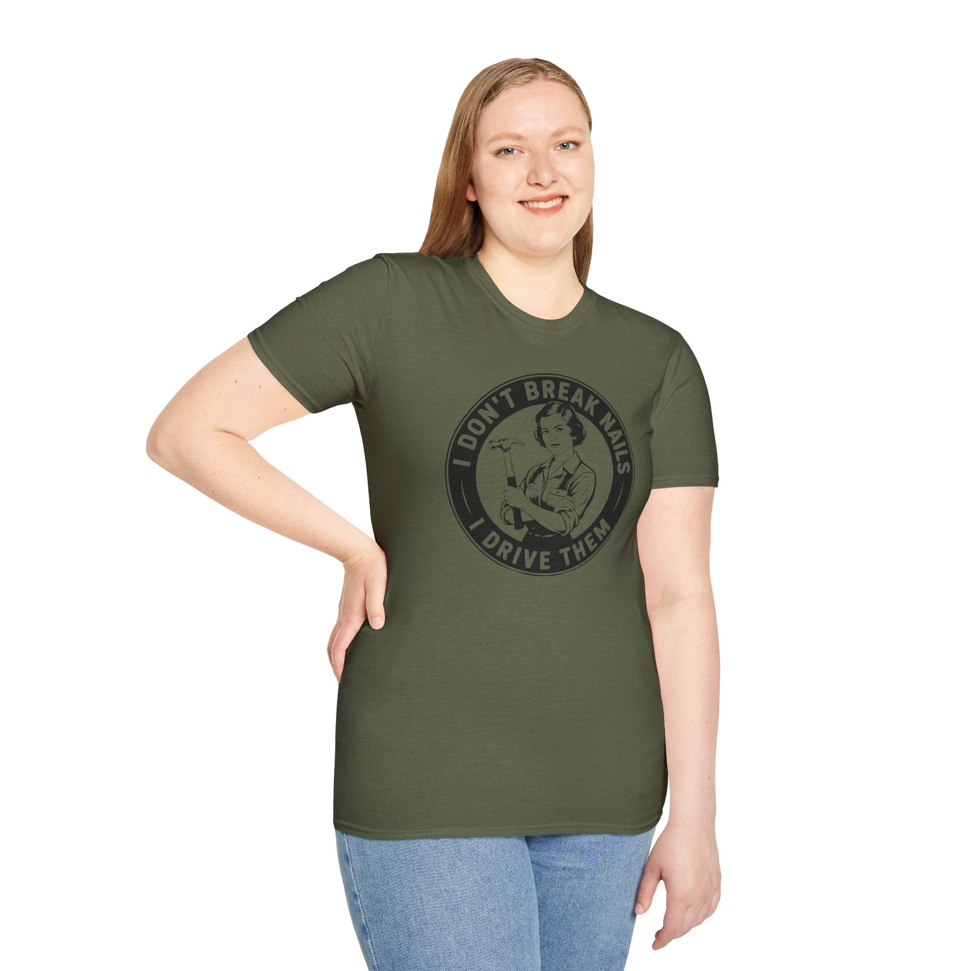 Woman wearing a Green t-shirt with a graphic and text 'I don't break nails, I drive them' on a white background